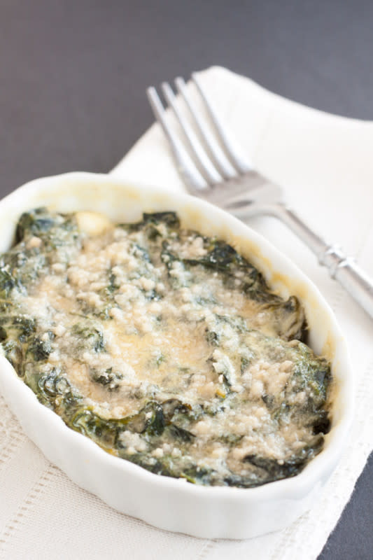 <p>Cupcakes & Kale Chips</p><p>Make this classic dish in individual servings or one casserole dish. </p><p><strong>Get the recipe: <a href="https://cupcakesandkalechips.com/creamed-spinach-au-gratin/" rel="nofollow noopener" target="_blank" data-ylk="slk:Lightened-Up Creamed Spinach au Gratin;elm:context_link;itc:0;sec:content-canvas" class="link ">Lightened-Up Creamed Spinach au Gratin</a> </strong></p>