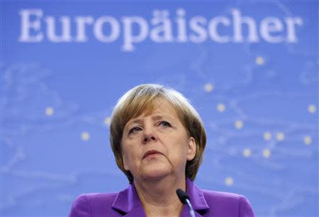 Germany's Chancellor Angela Merkel addresses a news conference during a European Union leaders summit in Brussels October 25, 2013. REUTERS/Francois Lenoir