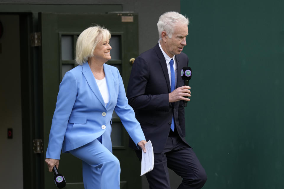 Former tennis player Sue Barker and John McEnroe arrive for a100 years of Centre Court celebration on day seven of the Wimbledon tennis championships in London, Sunday, July 3, 2022. (AP Photo/Kirsty Wigglesworth)