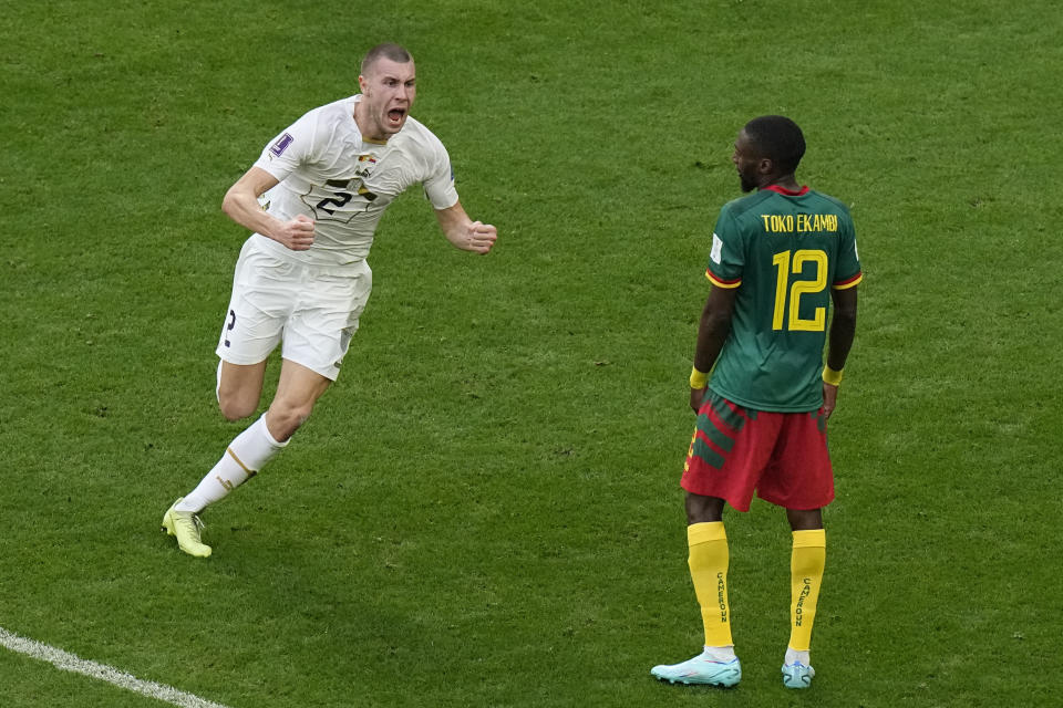 Serbia's Strahinja Pavlovic celebrates after scoring his side's first goal during the World Cup group G soccer match between Cameroon and Serbia, at the Al Janoub Stadium in Al Wakrah, Qatar, Monday, Nov. 28, 2022. (AP Photo/Pavel Golovkin)