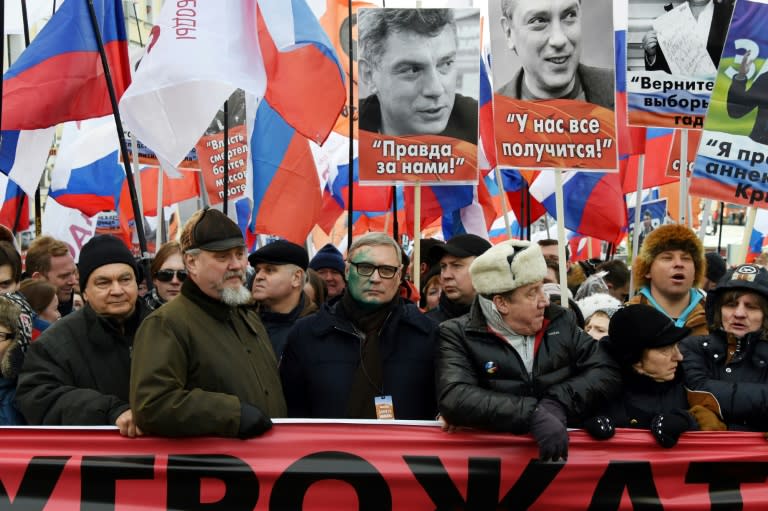 Russians march in Moscow in memory of slain opposition leader Boris Nemtsov