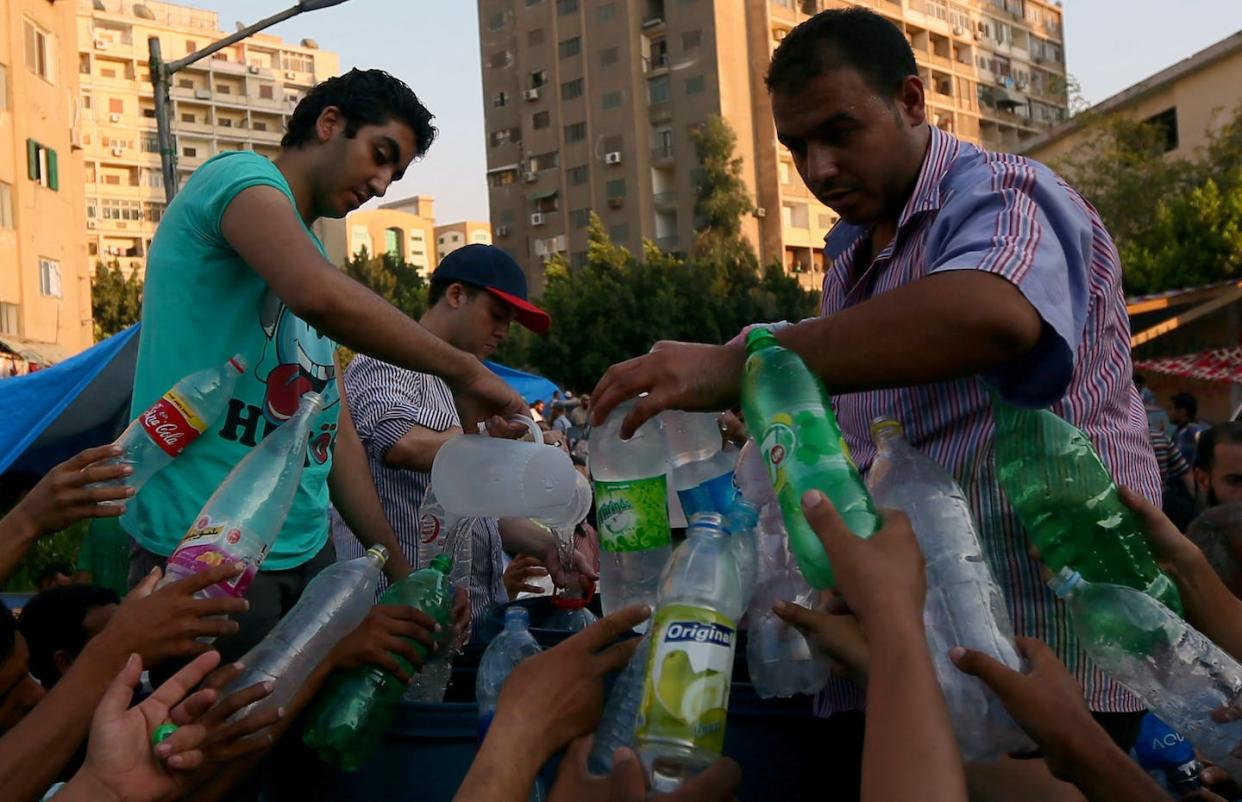 Plastic, yes. But at least the bottles are being reused. <a href="https://www.gettyimages.com/detail/news-photo/supporters-of-ousted-egyptian-president-mohamed-morsi-news-photo/173359900?phrase=ramadan%20water%20bottles&adppopup=true" rel="nofollow noopener" target="_blank" data-ylk="slk:Marwan Naamani/AFP via Getty Images);elm:context_link;itc:0;sec:content-canvas" class="link ">Marwan Naamani/AFP via Getty Images)</a>