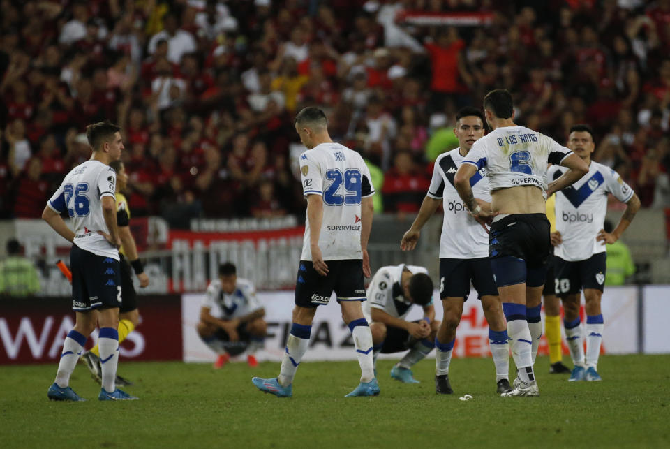 Players of Argentina's Velez Sarsfield reacts after losing 2-1 against Brazil's Flamengo at the end of a Copa Libertadores semifinal second leg soccer match at Maracana stadium in Rio de Janeiro, Brazil, Wednesday, Sept. 7, 2022. Brazil's Flamengo won 2-1 and qualified to the final. (AP Photo/Bruna Prado)