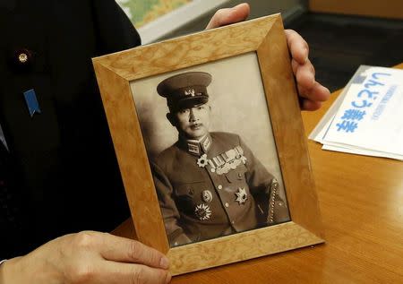 A picture of Tadamichi Kuribayashi, commander of the Japanese troops who fought and died in the battle of Iwo Jima, is shown by his grandson Yoshitaka Shindo, a conservative ruling party lawmaker, during an interview with Reuters in Tokyo March 18, 2015. REUTERS/Yuya Shino