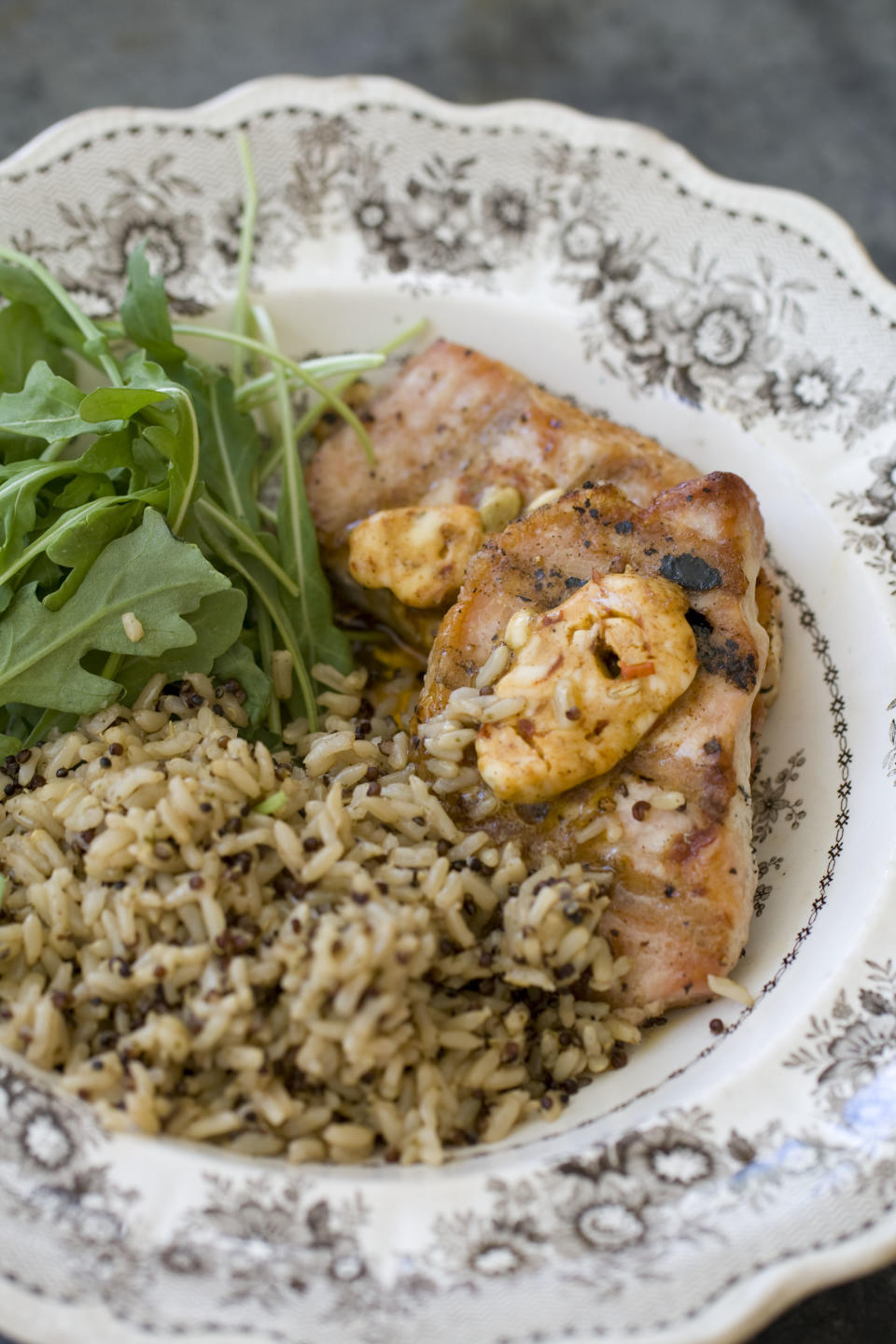 This Sept. 30, 2013 photo shows pork chops with chipotle pumpkin seed butter in Concord, N.H. (AP Photo/Matthew Mead)