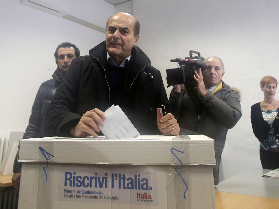 Pier Luigi Bersani, leader of the center-left Democratic Party, casts his vote during a primary runoff, in Piacenza, Italy, Sunday, Dec. 2, 2012. Italians are choosing a center-left candidate for premier for elections early next year, an important primary runoff given the main party is ahead in the polls against a center-right camp in utter chaos over whether Silvio Berlusconi will run again. Sunday's runoff pits veteran center-left leader Pier Luigi Bersani, 61, against the 37-year-old mayor of Florence, Matteo Renzi, not shown, who has campaigned on an Obama-style "Let's change Italy now" mantra. (AP Photo/Antonio Calanni)