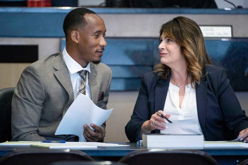 Former Florida State University and NFL wide receiver Travis Rudolph talks to his defense attorney Heidi Peret before jury selection in his first-degree murder trial in West Palm Beach, Florida on May 19, 2023.