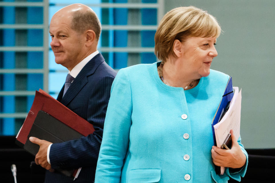 BERLIN, GERMANY - AUGUST 19: German Chancellor Angela Merkel (R) and German Minister of Finance Olaf Scholz attend a cabinet meeting at the German chancellery on August 19, 2020 in Berlin, Germany.  (Photo by Clemens Bilan Pool/Getty Images)