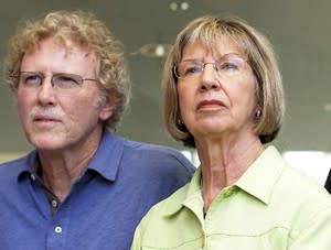 Pam Simon (right) stands with fellow January 8th survivor Randy Gardner after a court hearing for Jared Loughner on August 7, 2012. (Joshua Lott/Reuters)