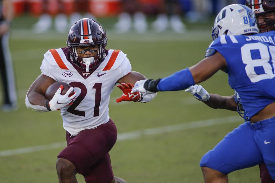 Virginia Tech running back Khalil Herbert (21) carries the ball against Duke during the second half of an NCAA college football game Saturday, Oct. 3, 2020, in Durham, N.C. (Nell Redmond/Pool Photo via AP)