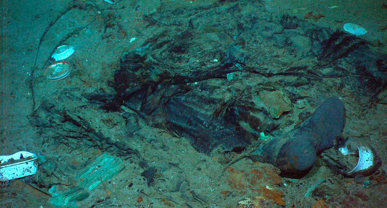 FILE - This 2004 photo provided by the Institute for Exploration, Center for Archaeological Oceanography/University of Rhode Island/NOAA Office of Ocean Exploration, shows the remains of a coat and boots in the mud on the sea bed near the Titanic&#39;s stern. (AP)