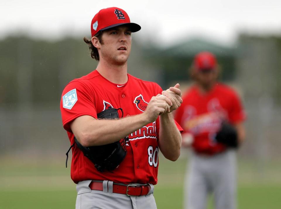 St. Louis Cardinals pitcher Jake Woodford rubs up a ball during spring training in 2019 in Jupiter, Florida.