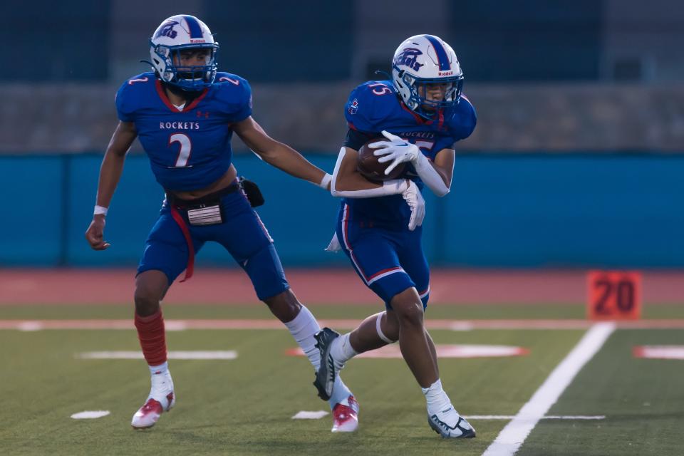 Irvin's Giovanni Soto (15) and Isaac Guerrero (2) at a high school football game against Bowie at Irvin High School in El Paso, Texas, on Thursday, Oct. 13, 2022.