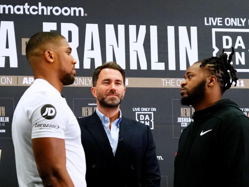 Anthony Joshua (left) with promoter Eddie Hearn (centre) and opponentJermaine Franklin (PA)