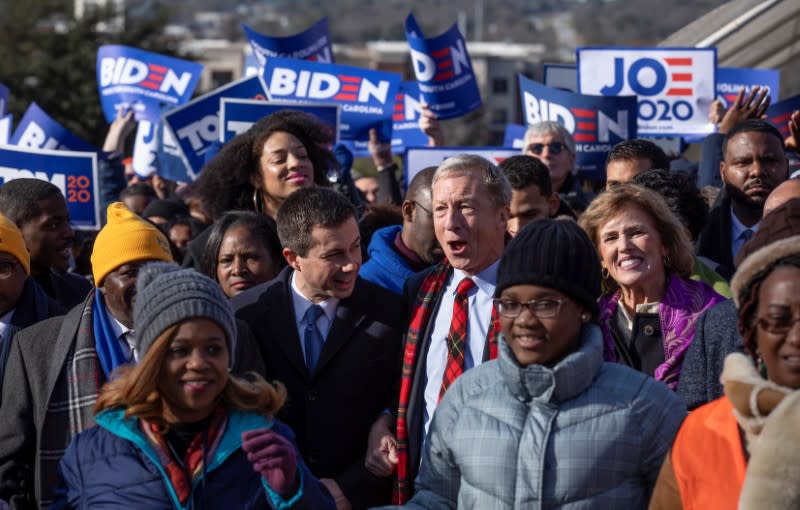 Democratic U.S. presidential candidate Tom Steyer marches with fellow Democratic U.S. presidential candidate Pete Buttigieg during the Martin Luther King Jr. Day parade in Columbia