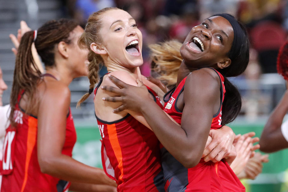 England’s Helen Housby, left, and Jodie Gibson celebrate victory (AP Photo/Mark Schiefelbein)