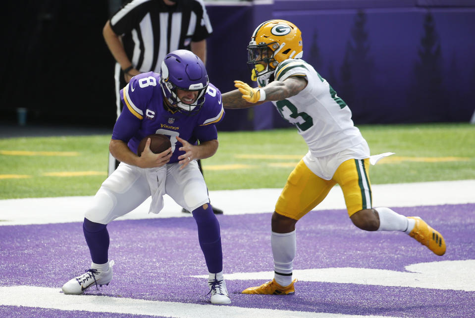 Green Bay Packers cornerback Jaire Alexander tackles Minnesota Vikings quarterback Kirk Cousins (8) in the end zone for a safety during the first half of an NFL football game, Sunday, Sept. 13, 2020, in Minneapolis. (AP Photo/Bruce Kluckhohn)