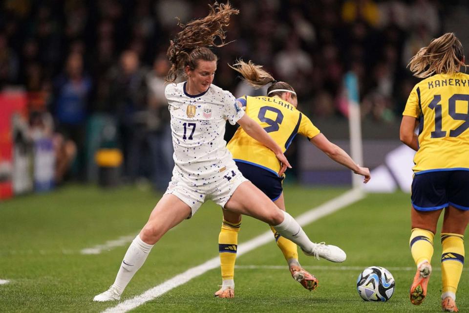 PHOTO: United States' Andi Sullivan, left, and Sweden's Kosovare Asllani, center, compete for the ball during the Women's World Cup Round of 16 soccer match in Melbourne, Australia, Sunday, Aug. 6, 2023. (Scott Barbour/AP)