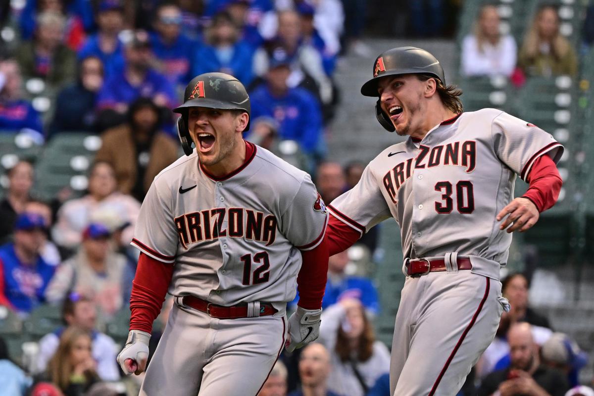 Votto hits 2 more homers as Reds roll past Cubs 7-4