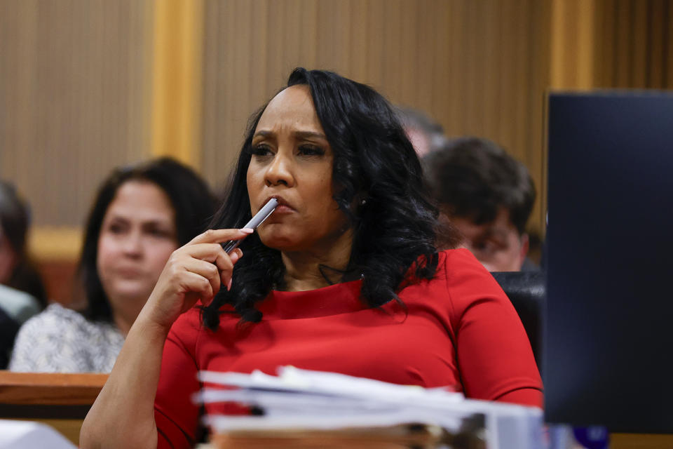 Fulton County District Attorney Fani Willis looks on during a hearing on the Georgia election interference case, Friday, March, 1, 2024, in Atlanta. The hearing is to determine whether Fulton County District Attorney Fani Willis should be removed from the case because of a relationship with Nathan Wade, special prosecutor she hired in the election interference case against former President Donald Trump. (AP Photo/Alex Slitz, Pool)