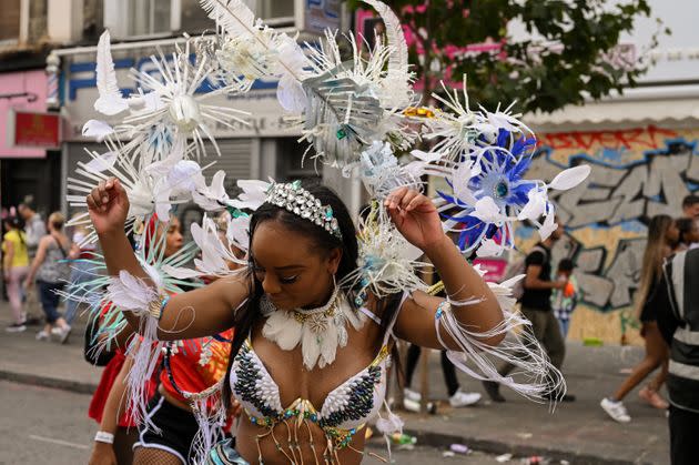 Bianca Wardally participates in the Notting Hill Carnival wearing a Vibrance Mas Band costume designed by Cee Bolakee. The outfit is inspired by the effects of climate change on coral reefs, particularly Bolakee's home island of Mauritius. (Photo: Clara Watt for HuffPost)