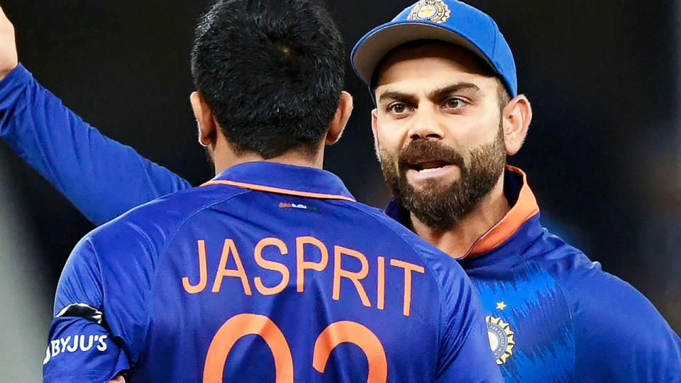 Virat Kohli, pictured here taling to teammate Jasprit Bumrah during India's clash with Namibia.