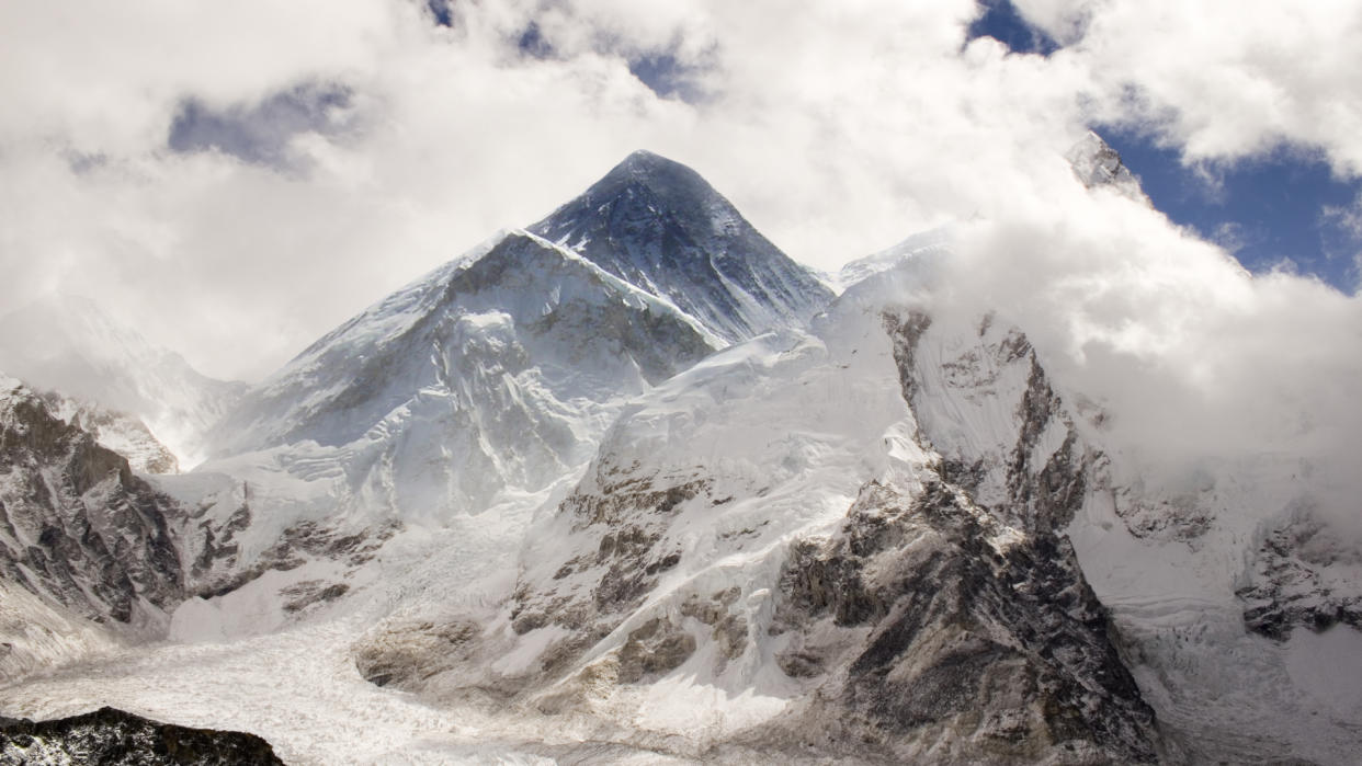  Mount Everest cloaked in clouds. 