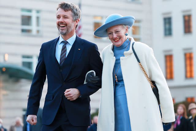<p>Maja Hitij/Getty Images</p> Then-Crown Prince Frederik of Denmark and his mother Queen Margrethe visit the Brandenburg Gate on November 10, 2021 in Berlin, Germany.