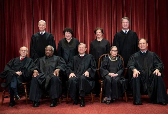FILE - In this Nov. 30, 2018, file photo, the justices of the U.S. Supreme Court gather for a formal group portrait at the Supreme Court Building in Washington. Seated from left: Associate Justice Stephen Breyer, Associate Justice Clarence Thomas, Chief Justice of the United States John G. Roberts, Associate Justice Ruth Bader Ginsburg and Associate Justice Samuel Alito Jr. Standing behind from left: Associate Justice Neil Gorsuch, Associate Justice Sonia Sotomayor, Associate Justice Elena Kagan and Associate Justice Brett M. Kavanaugh. The Supreme Court term has steered clear of drama since the tumultuous confirmation of Justice Brett Kavanaugh. The next few weeks will test whether the calm can last. (AP Photo/J. Scott Applewhite, File)