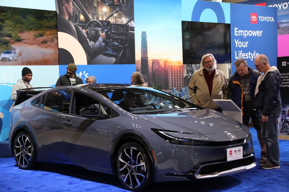 Visitors check details of a car at the New York International Auto Show 2024 in New York, the United States, on March 29, 2024. The New York International Auto Show 2024 opened to the public on Friday with models from over 20 manufacturers on exhibition. (Photo by Liu Yanan/Xinhua via Getty Images)