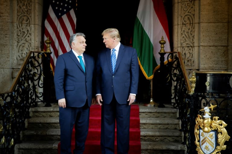 This handout photograph taken and released on March 8, 2024, by the Press Office of the Hungarian Prime Minister, shows Hungarian Prime Minister Viktor Orban (L) and former US President and Republican presidential candidate, Donald Trump in Florida (ZOLTAN FISCHER)