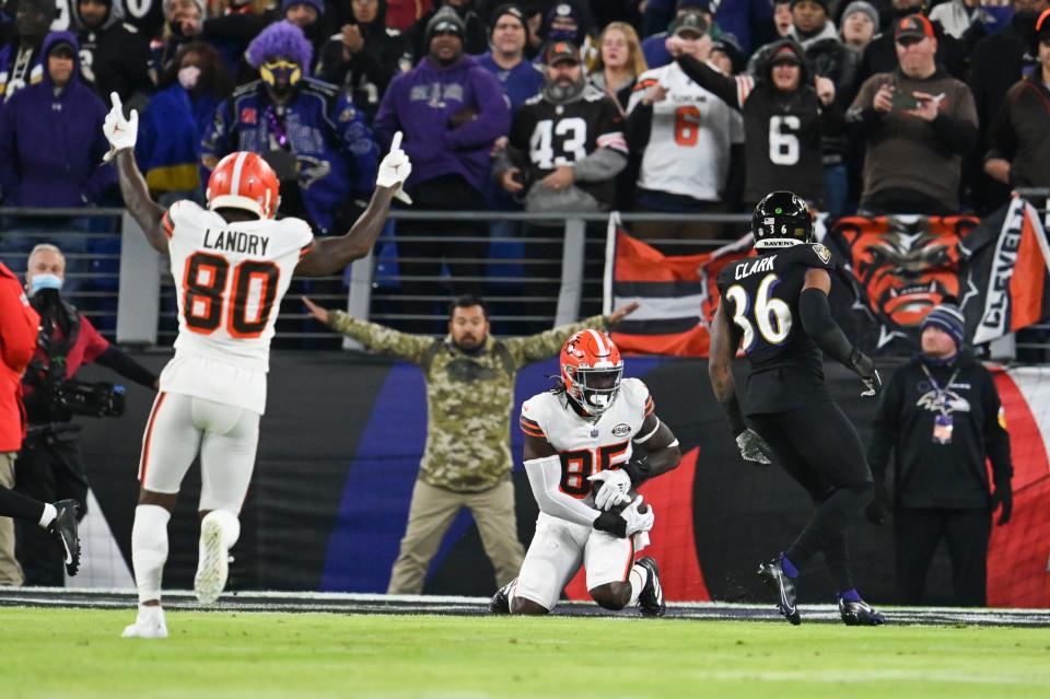 Nov 28, 2021; Baltimore, Maryland, USA;  Cleveland Browns tight end David Njoku (85) catches a pass for a touchdown  in front of Baltimore Ravens safety Chuck Clark (36) as C wide receiver Jarvis Landry (80) celebrates at M&T Bank Stadium. Mandatory Credit: Tommy Gilligan-USA TODAY Sports
