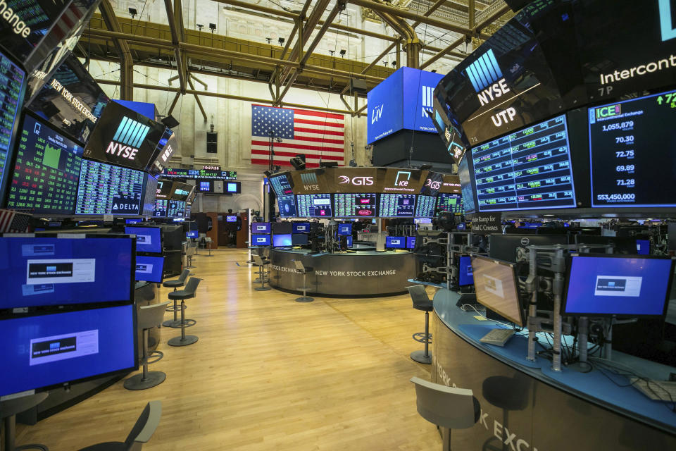 This photo provided by the New York Stock Exchange shows the unoccupied NYSE trading floor, closed temporarily for the first time in 228 years as a result of coronavirus concerns, Tuesday March 24, 2020. (Kearney Ferguson/NYSE via AP)