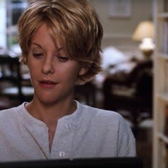 Meg Ryan typing on a laptop in 