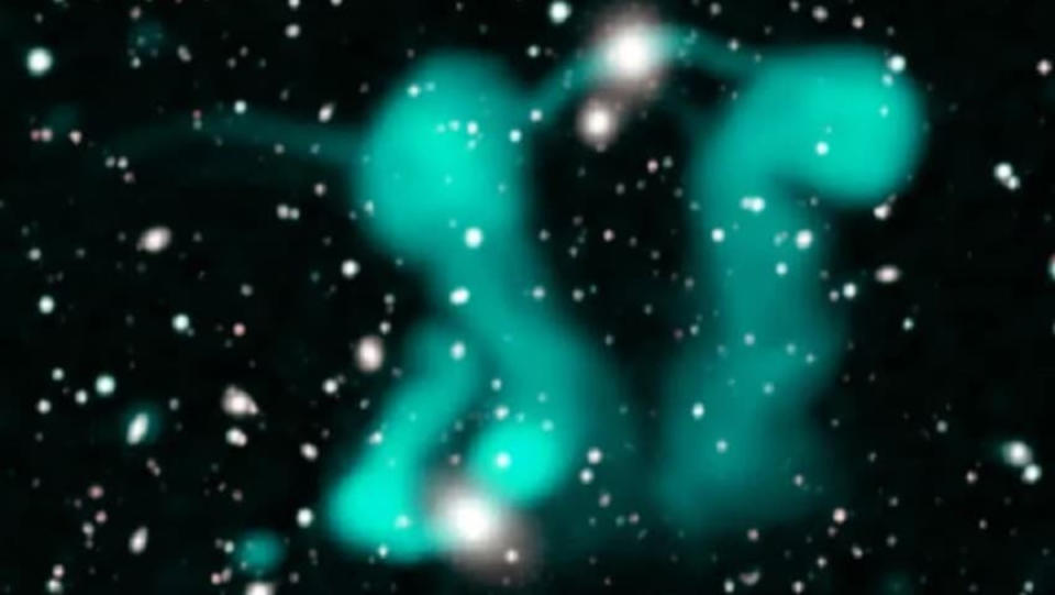 Two radio galaxies approximately a billion light-years away which, together, look like greenish dancing ghosts.