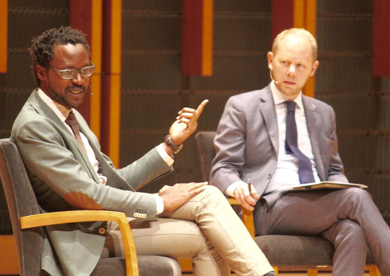 Hope professor Kevin Kambo speaks during a panel discussion about race Wednesday, Sept. 8, while Hope President Matthew Scogin listens. 