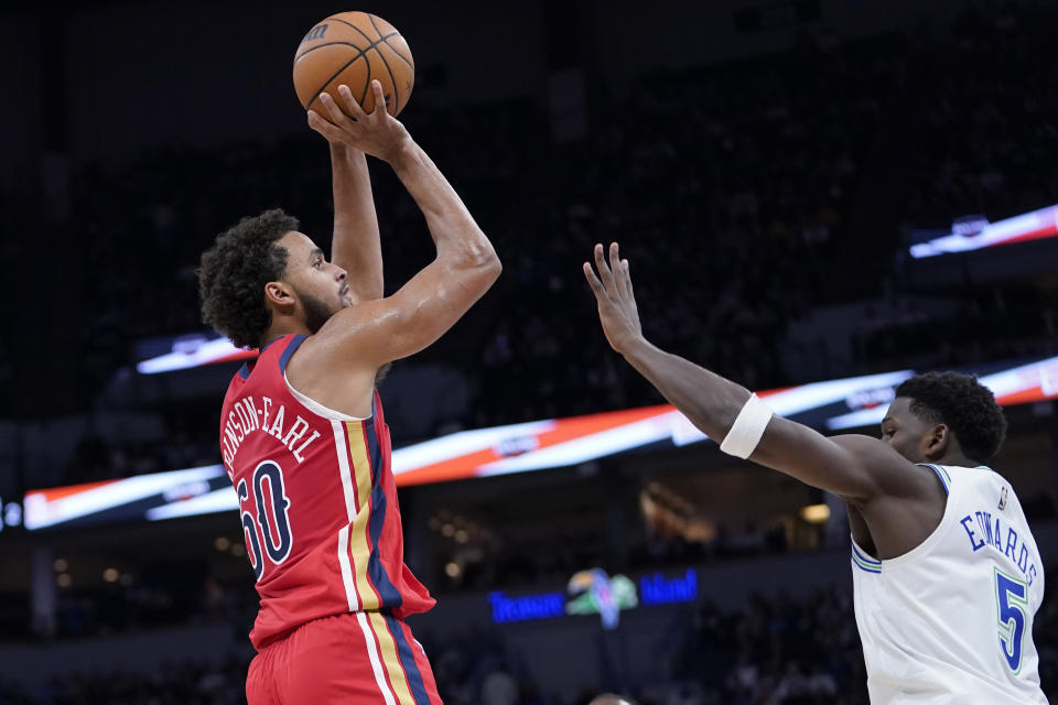 New Orleans Pelicans forward Jeremiah Robinson-Earl (50) shoots over Minnesota Timberwolves guard Anthony Edwards (5) during the first half of an NBA basketball game, Wednesday, Nov. 8, 2023, in Minneapolis. (AP Photo/Abbie Parr)