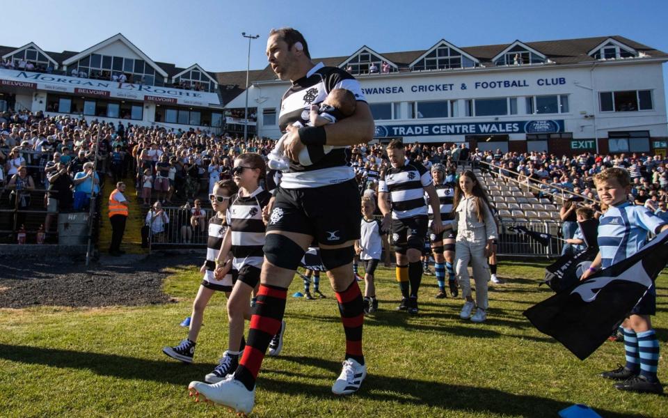 Swansea RFC v Barbarians RFC - Alun Wyn Jones of Barbarians walks onto the field with his children - The long goodbye for Alun Wyn Jones - Huw Evans Agency/Chris Fairweather