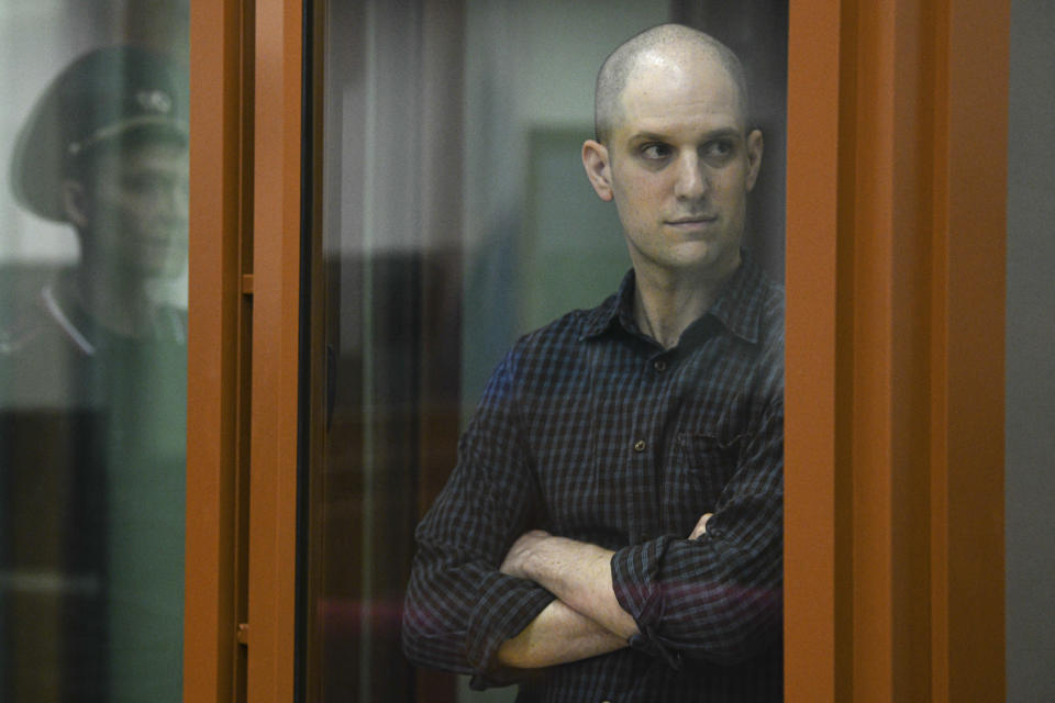 Wall Street Journal reporter Evan Gershkovich stands in a glass cage in a courtroom in Yekaterinburg, Russia, Wednesday, June 26, 2024. Fifteen months after he was arrested in the city of Yekaterinburg on espionage charges, Gershkovich returns there for his trial starting Wednesday behind closed doors. Gershkovich, his employer and the U.S. government deny the charges. (AP Photo)