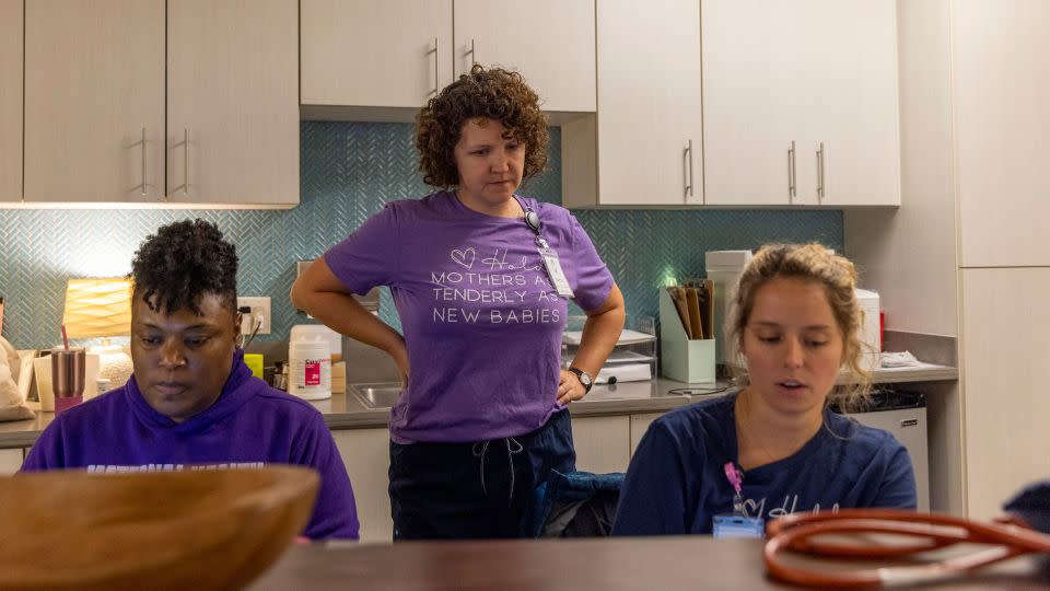 Atlanta Birth Center birth nurse Retta Sola, center, speaks with student nurse midwife Shanti Moore, left, and midwife Hannah Walters, at their work station while waiting for a patient to give birth in November. - Alyssa Pointer for CNN