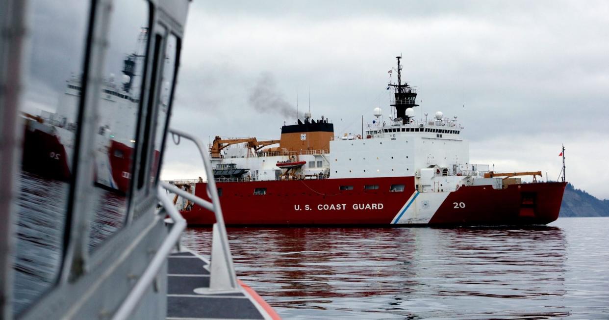 The U.S. Coast Guard Cutter Healy makes its way through the Puget Sound on its way Thursday, Oct. 29, 2015, to its homeport of Seattle. The 420-foot polar icebreaker, the country's newest high-latitude vessel, returned to Seattle after cutting its way to the North Pole in support of a mission to study the health of the Arctic Ocean. (AP Photo/Elaine Thompson)