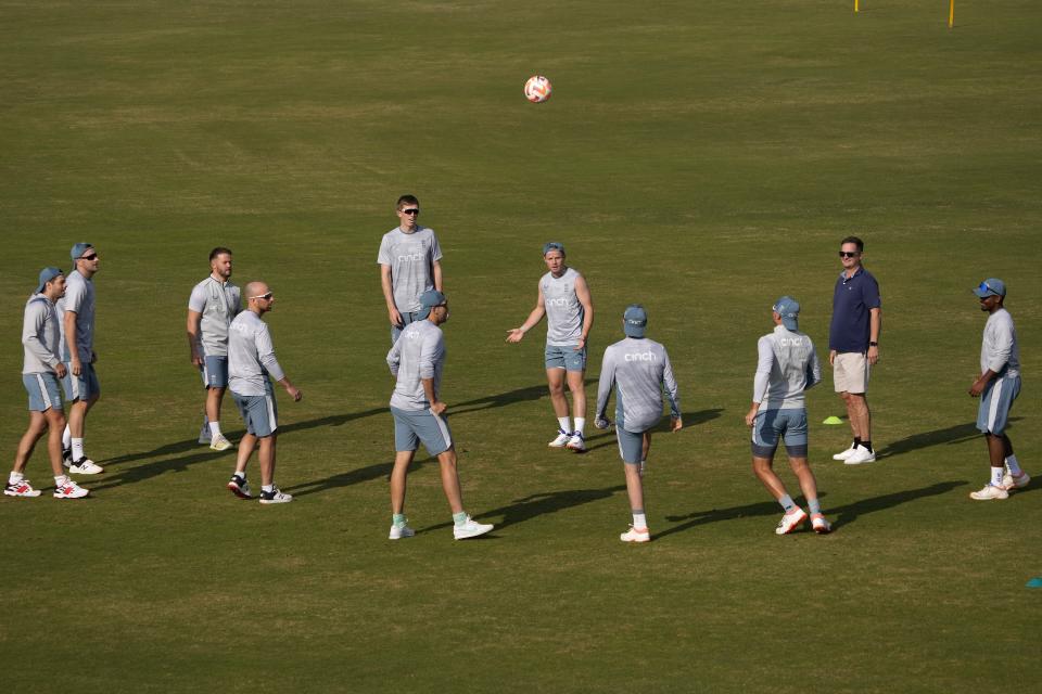 England's Ollie Pope, center, and teammates play with soccer ball during a training session, in Rawalpindi, Pakistan, Monday, Nov. 28, 2022. England's team arrived in Pakistan to play three-test cricket matches starting from Dec. 1. (AP Photo/Anjum Naveed)