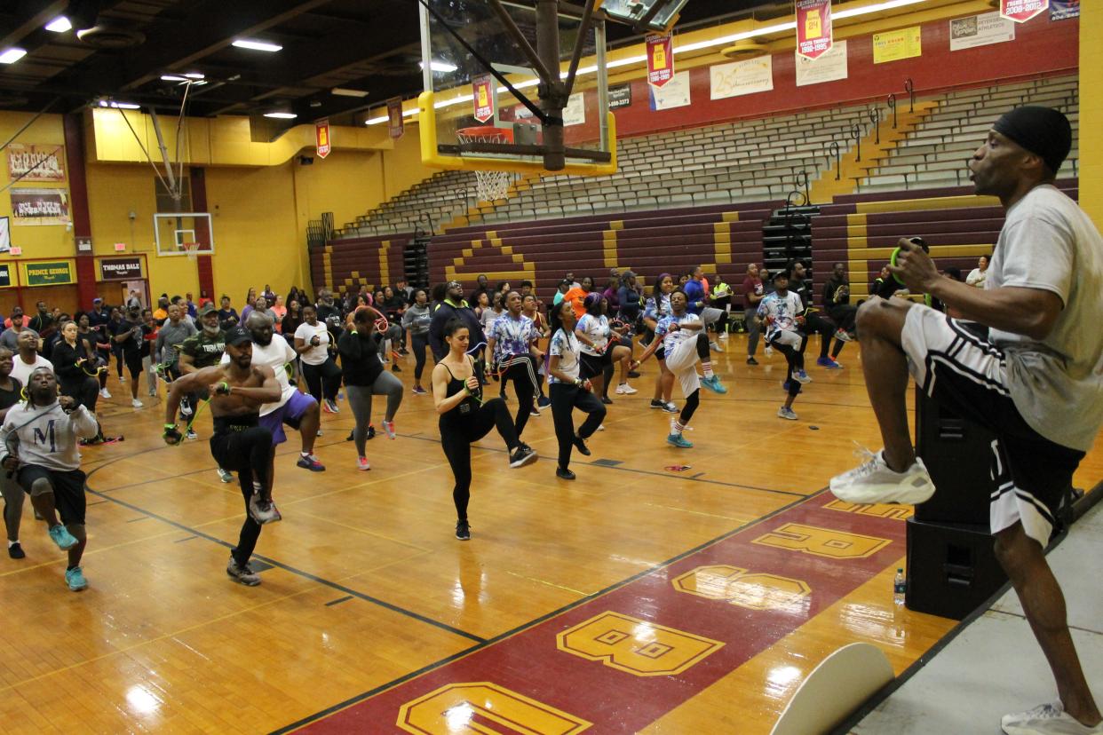 Petersburg native Don Brooks aka DB DONAMATRIX celebrity fitness trainer leads a workout in the high school gym during Petersburg's first hometown fitness festival "Donamatrix Day" on April 6, 2019.