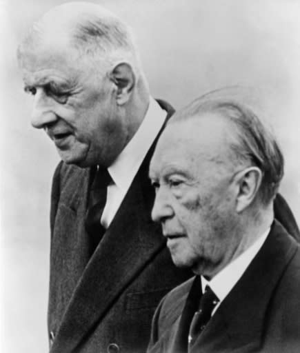 Merkel and Macron will sign the deal on the anniversary of the 1963 Franco-German cooperation treaty signed by France's Charles de Gaulle (left) and the then German chancellor Konrad Adenauer