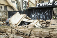 <p>A car is covered in debris from a building destroyed by Hurricane Maria in Puerto Rico which ravaged the island, Puerta de Tierra, San Juan, P.R., Thursday, Sept. 21, 2017. Maria landed as a category 4 storm early Wednesday leaving the entire American territory without power and mostly with out communications. (© Erika P. Rodriguez for The New York Times) </p>