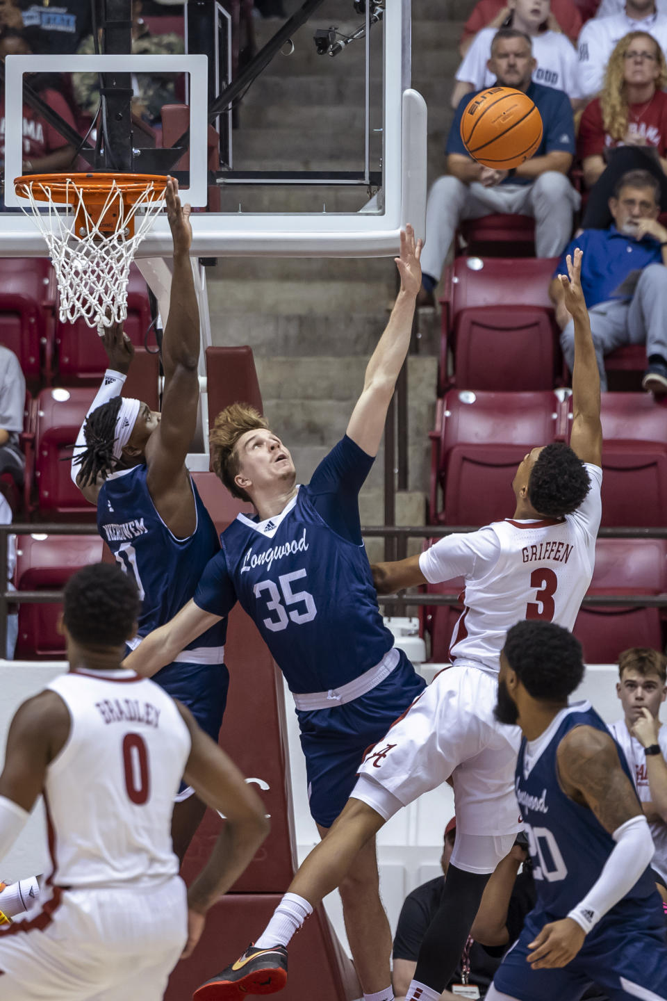 Alabama guard Rylan Griffen (3) shoots over Longwood forwards Leslie Nkereuwem (0) and Jesper Granlund (35) during the first half of an NCAA college basketball game Monday, Nov. 7, 2022, in Tuscaloosa, Ala. (AP Photo/Vasha Hunt)