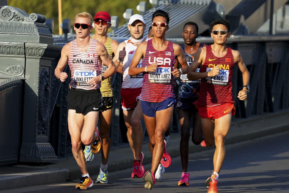 Canada’s Rory Linkletter, Nico Montanez of the U.S. and China’s Feng Peiyou compete in the Men’s marathon at the World Athletics Championships in Budapest, Hungary, Sunday, Aug. 27, 2023. | Aleksandra Szmigiel, pool via Associated Press