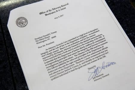 This picture shows a copy of the letter by U.S. Attorney General Jeff Sessions to U.S. President Donald Trump recomending the firing of Director of the FBI James Comey, at the White House in Washington, U.S., May 9, 2017. REUTERS/Joshua Roberts/Files