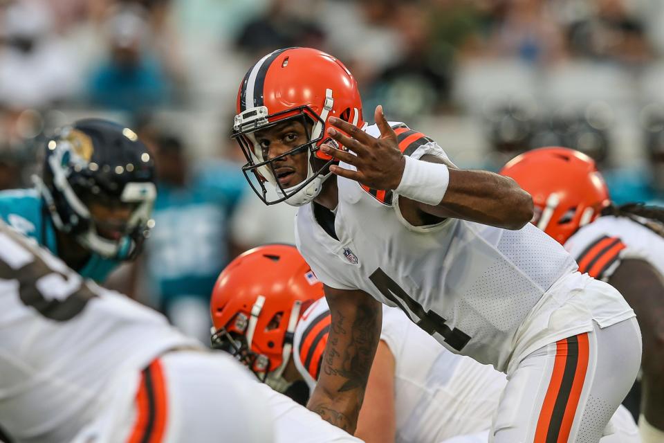 Browns quarterback Deshaun Watson signals a teammate during the first half of a preseason game at the Jacksonville Jaguars, Friday, Aug. 12, 2022.