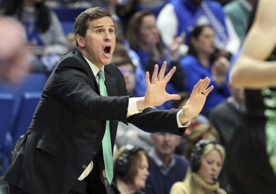 FILE - Utah Valley head coach Mark Madsen directs his team during the first half of an NCAA college basketball game against Kentucky in Lexington, Ky., Monday, Nov. 18, 2019. Madsen says player Fardaws Aimaq was called “a terrorist” by a heckling fan after a game against UTEP this week in the SoCal Challenge. Aimaq's parents are Afghan refugees. Maden says Aimaq was allegedly subjected to abhorrent and offensive comments from a fan on Monday, Nov. 20, 2023. (AP Photo/James Crisp, File)